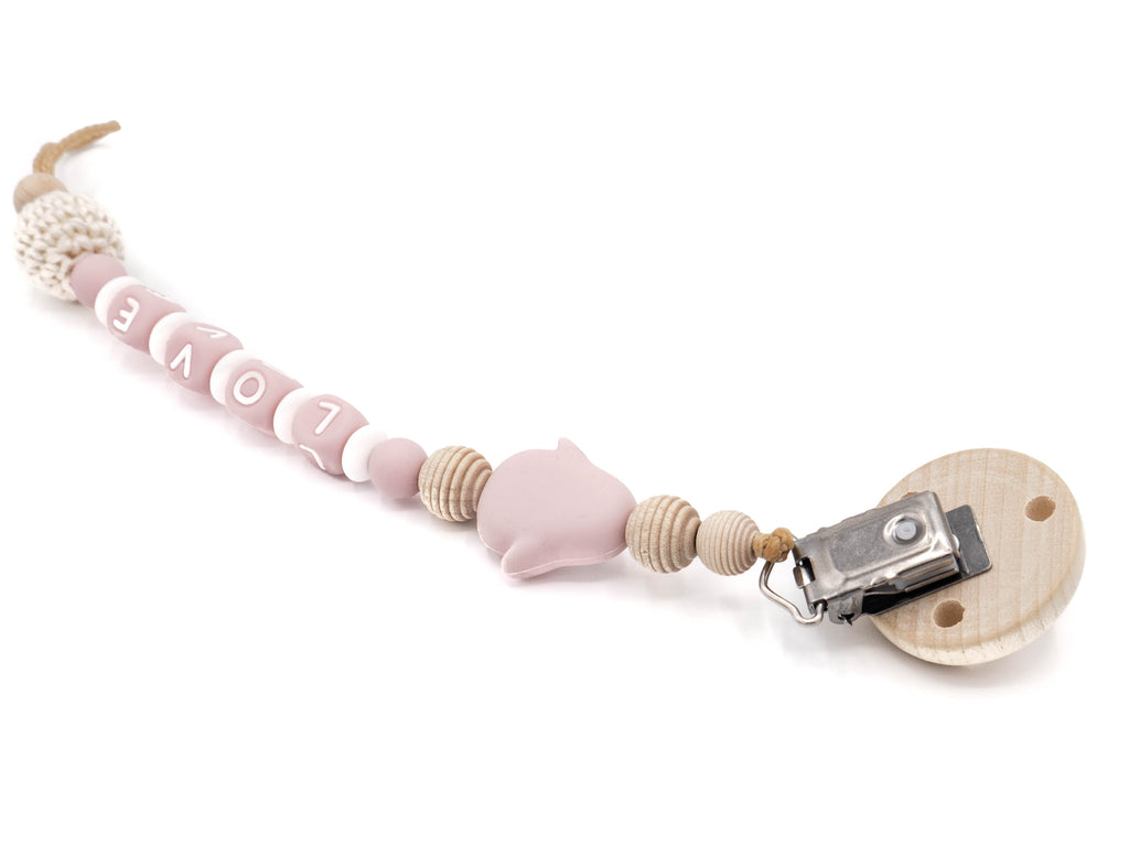 Handgefertigte und individuelle Schnullerkette rosa Pinguin - Schnullerkettenwelt