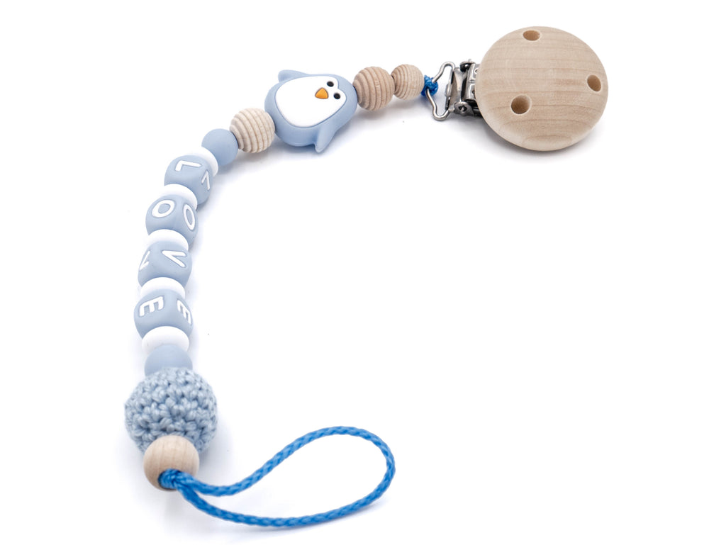 Handgefertigte und individuelle Schnullerkette blauer Pinguin - Schnullerkettenwelt