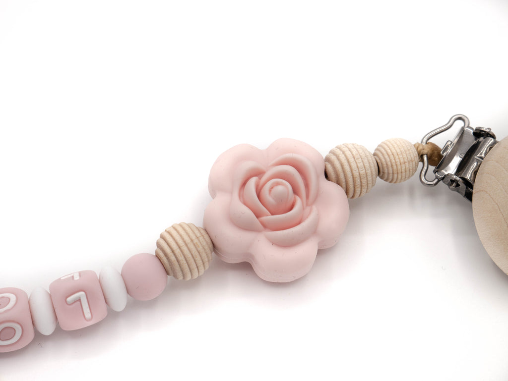 Handgefertigte und individuelle Schnullerkette rosa Rose - Schnullerkettenwelt